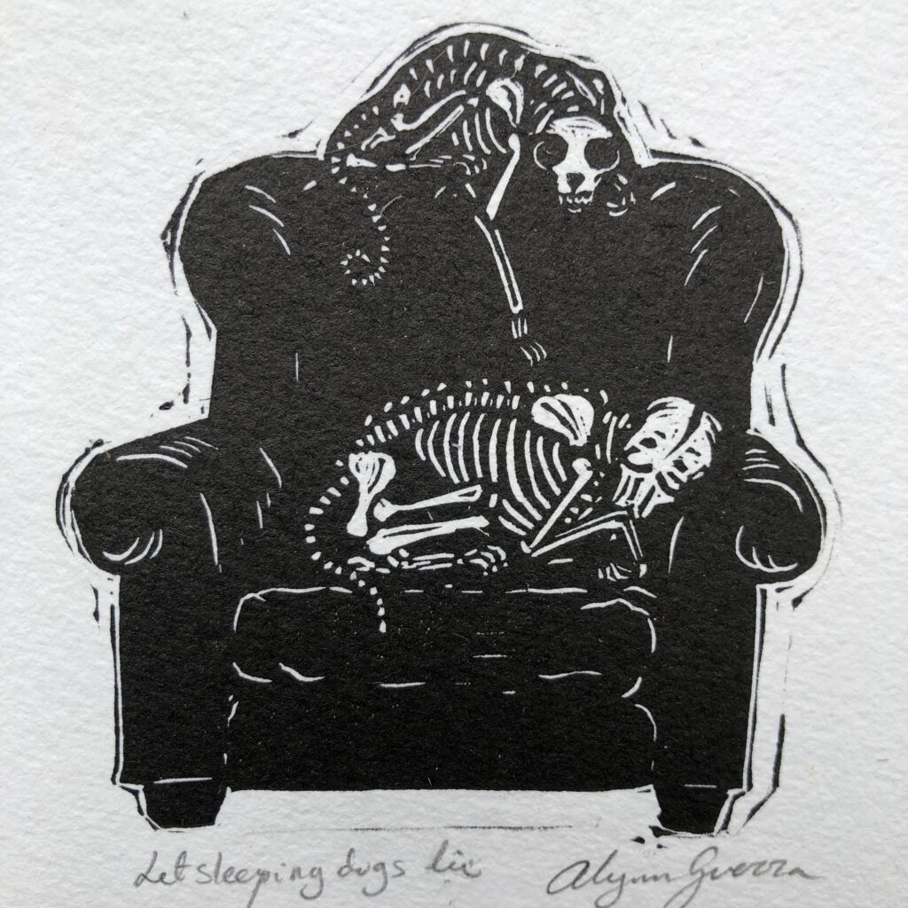A hand-carved stamp of a skeleton dog on a couch by Red Hydrant Press