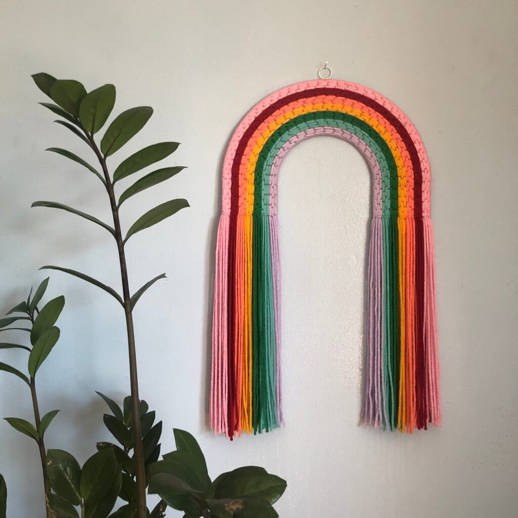 A macrame rainbow created by Rehabbed Handmade